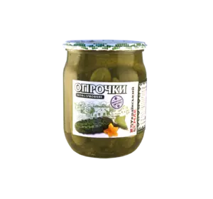 Огурчики  консервированные зеленью в стеклянной банке 525г Огурчики  консервированные зеленью в стеклянной банке 525г